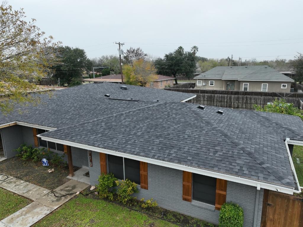 Completed residential shingle roof on a San Juan, Texas home