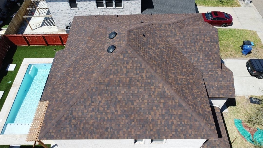 Completed residential shingle roof on a Weslaco, Texas home
