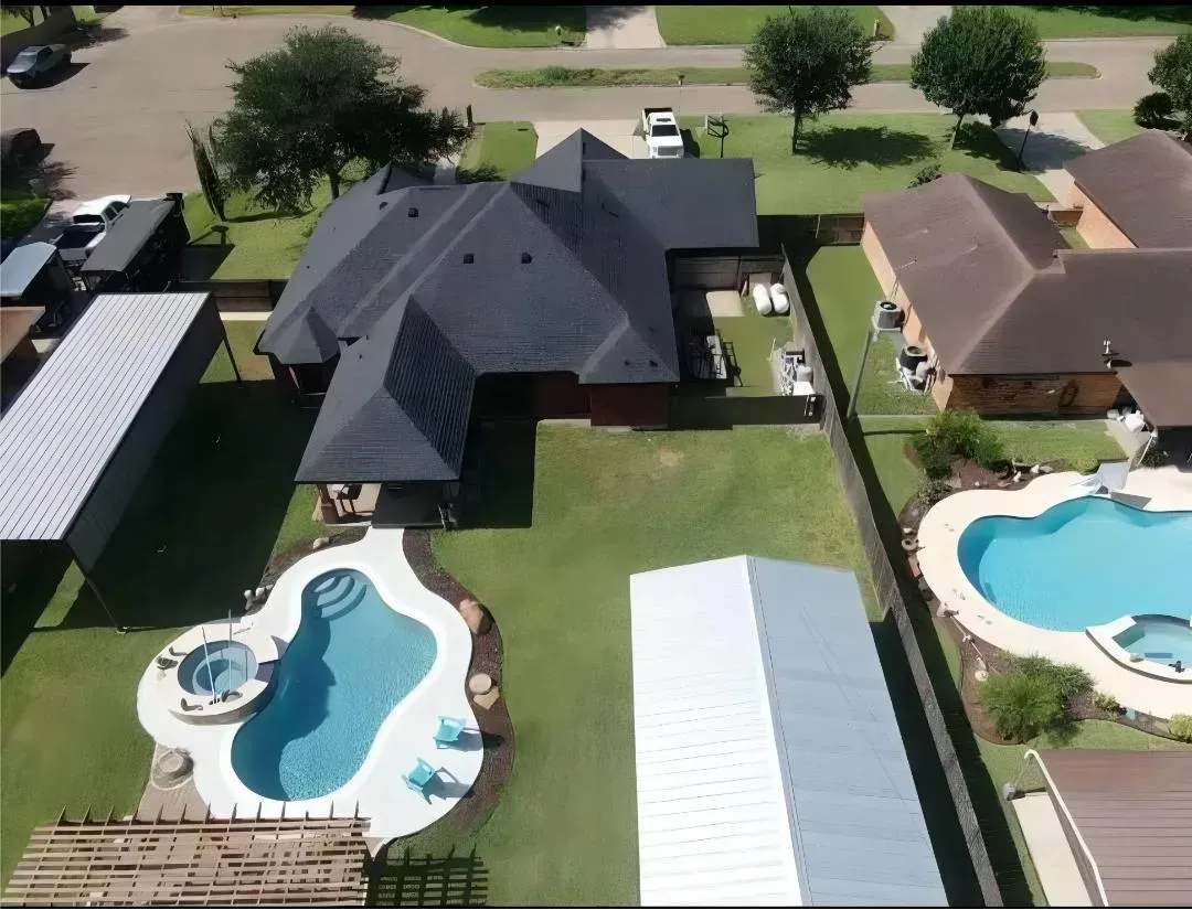 Completed roof replacement on a two-story home in Edinburg, Texas