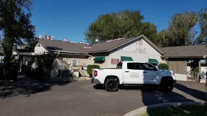 Hidalgo Roofing truck on site during a roof tear-off in Edinburg, Texas