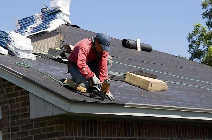 Roofing crew replacing storm-damaged shingles in McAllen, Texas