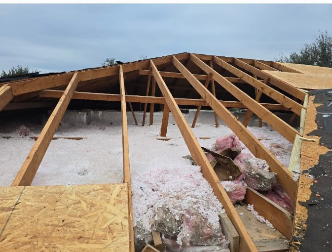 Roof decking and rafters opened up during storm-damage repair on an Edinburg, Texas home