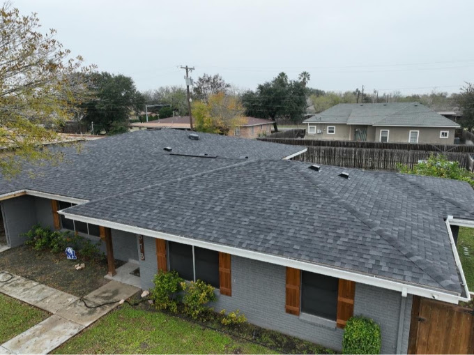 Single-story home with a continuous shingle roofline in Mission, Texas