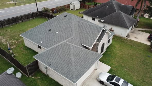 Hip roof and attached lower roofline on an Edinburg, Texas home