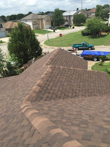 Roof-level view of a shingle roof during a roof repair in Pharr, Texas