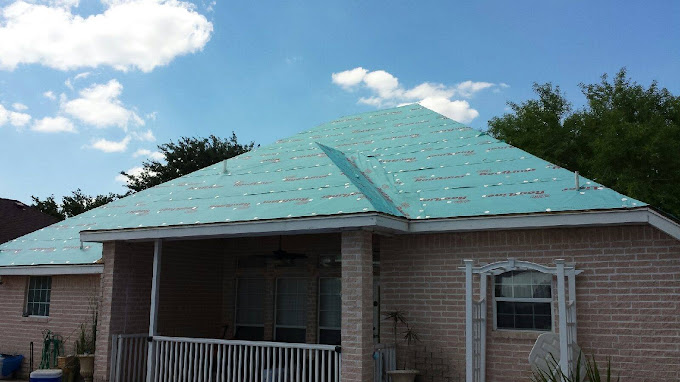 Storm-damaged roof dried in with new underlayment on a Pharr, Texas home